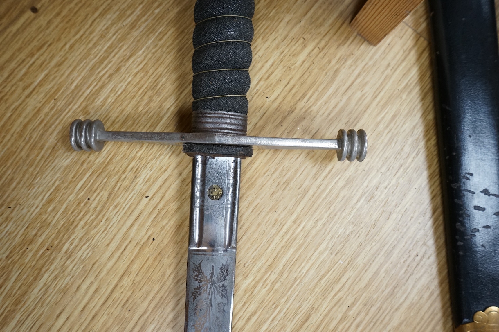 World War I Scottish infantry officer’s undress sword, etched and polished regulation blade with crowned GVR cipher and regulation cruciform hilt, in its steel scabbard